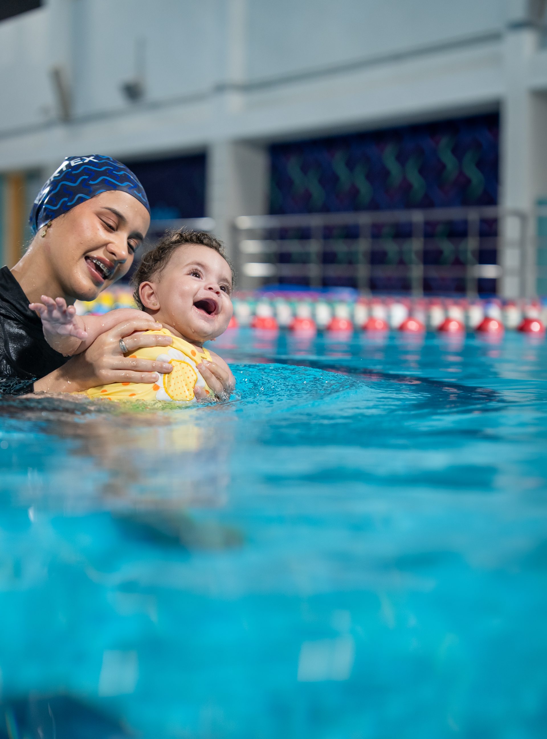 A baby in a parent and child swimming session