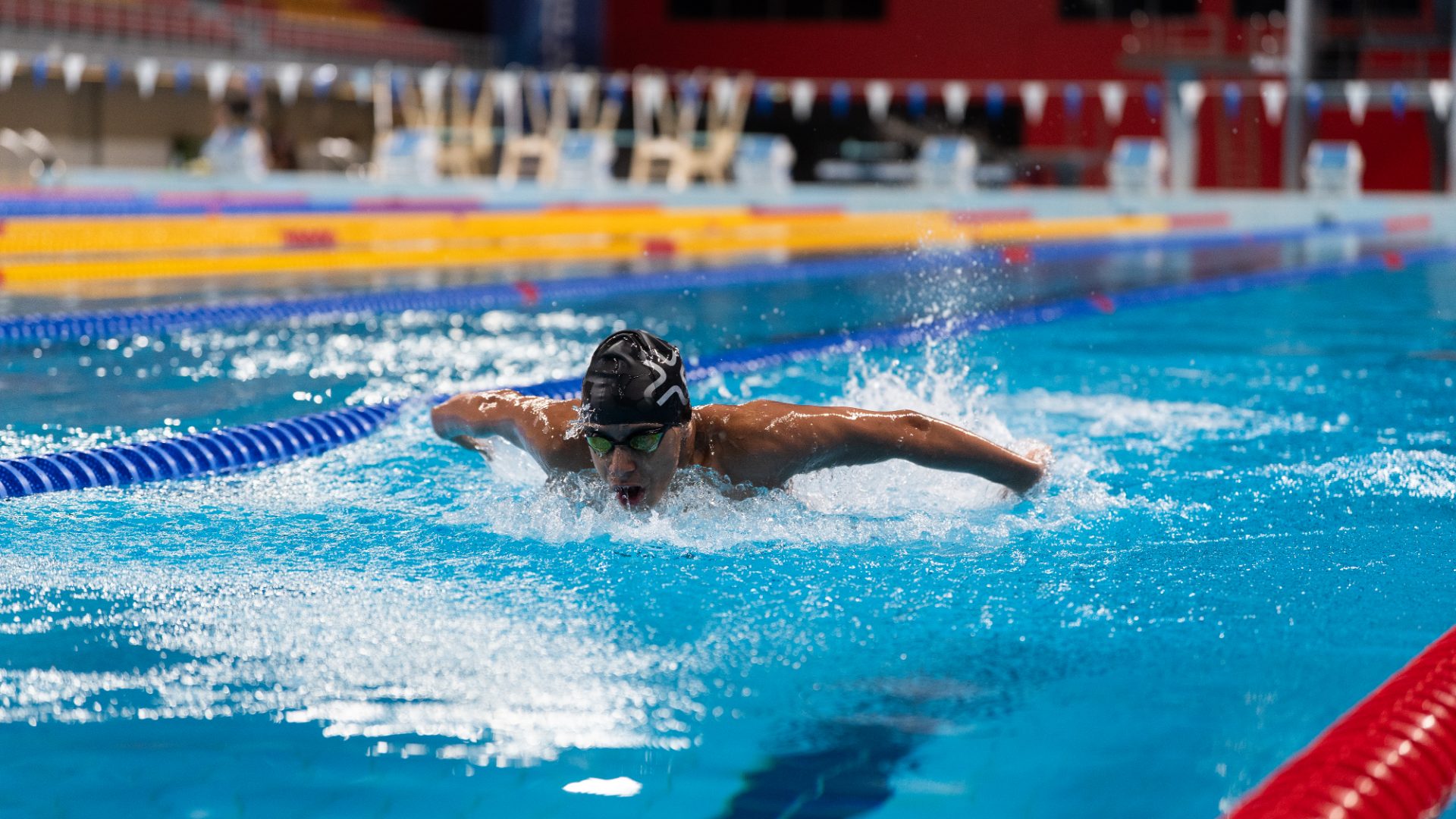 Competitive swimmer mid butterfly stroke