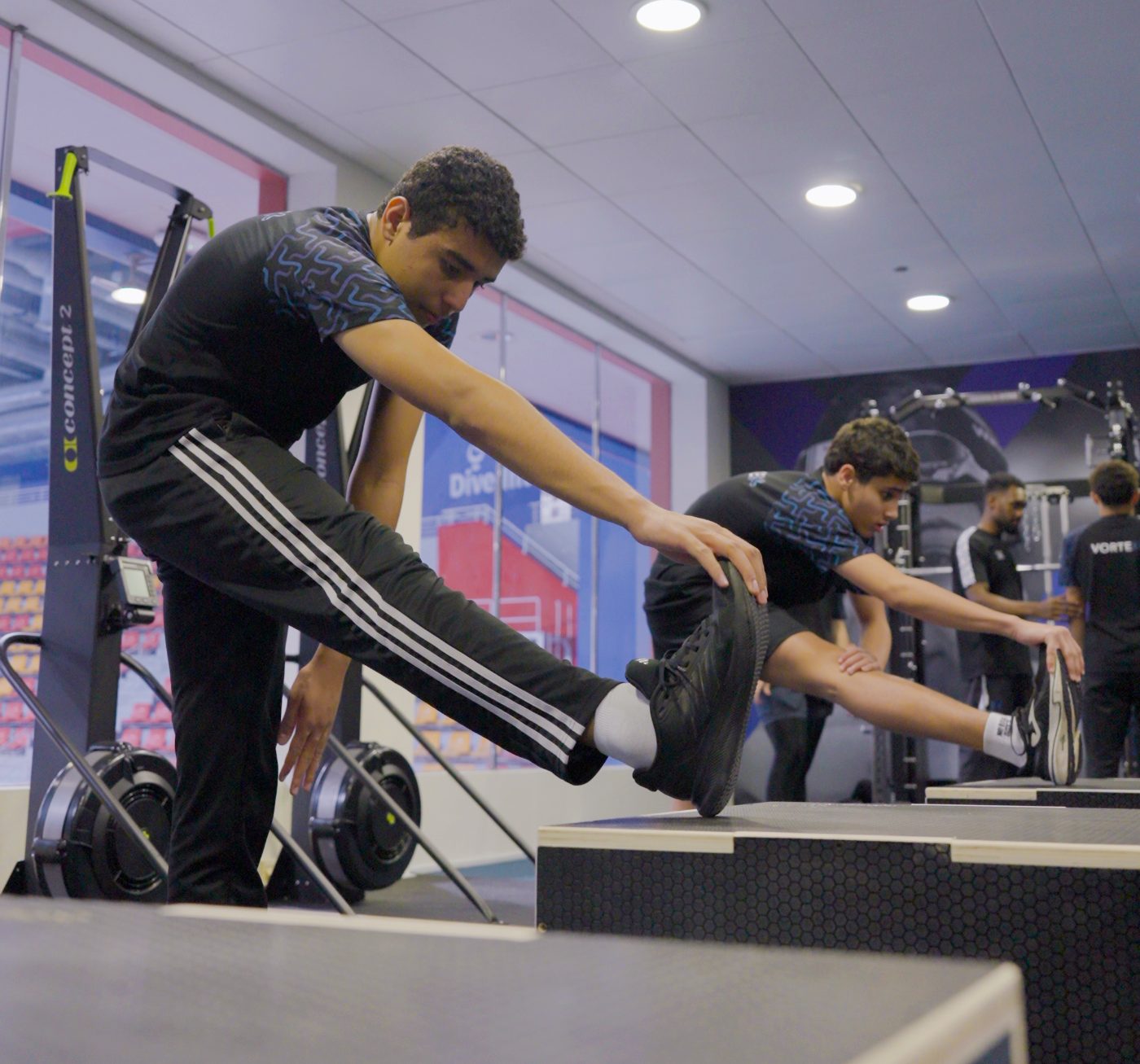 Vortex Swimming Club athletes training in the branded club fitness room