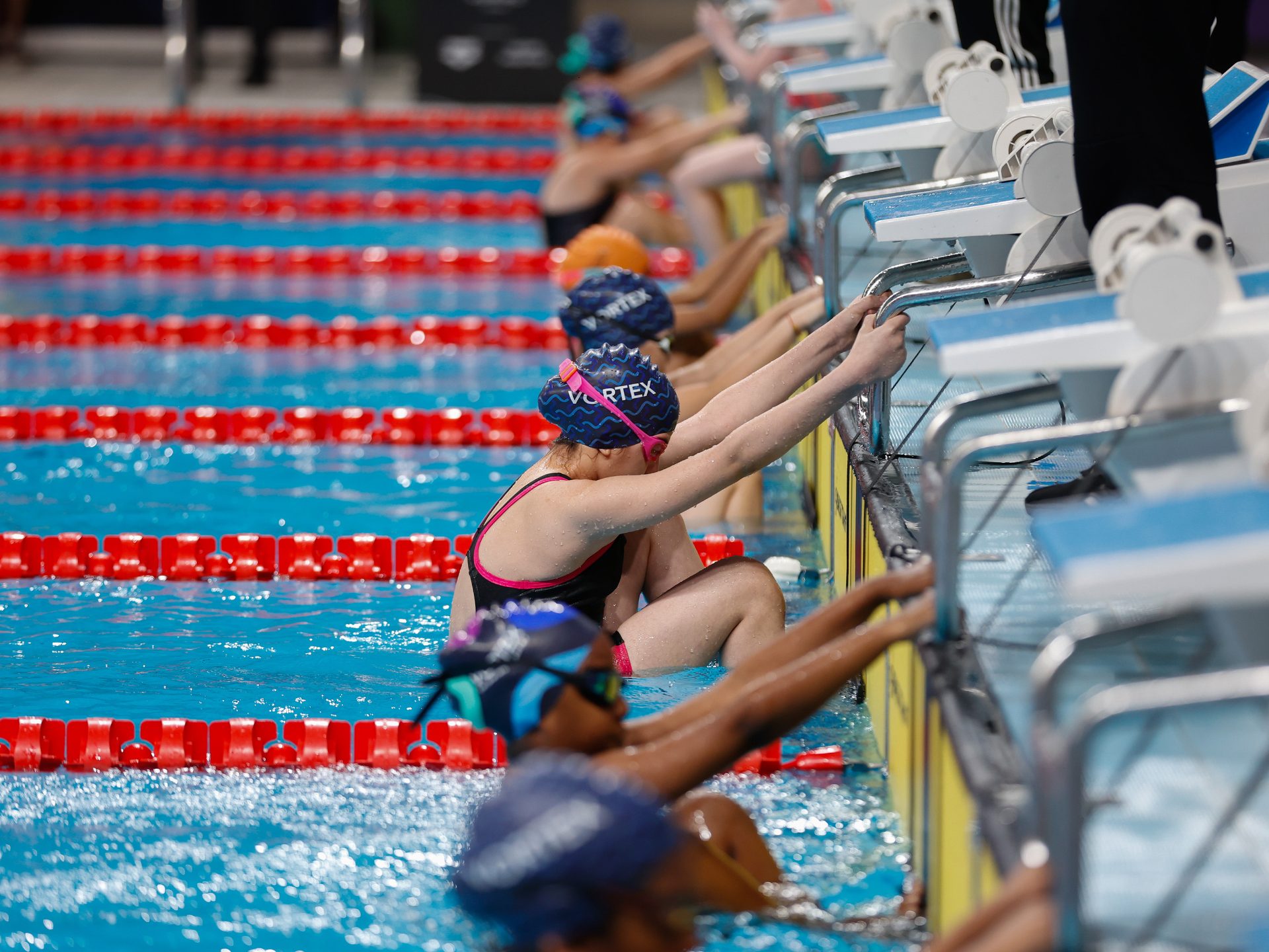 A competitive swimmer mid stroke